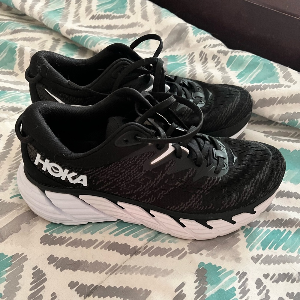Women’s black and whit Hoka gym shoes